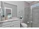 Well-lit bathroom with modern vanity, glass-enclosed shower, and stylish fixtures at 7699 Sw 74Th Loop, Ocala, FL 34481