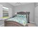 Bedroom with window, ceiling fan, and closet at 7699 Sw 74Th Loop, Ocala, FL 34481