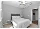 Bedroom featuring neutral walls, carpet and an ensuite bathroom at 7699 Sw 74Th Loop, Ocala, FL 34481