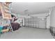 Spacious garage with epoxy flooring, and an automatic door at 7699 Sw 74Th Loop, Ocala, FL 34481