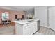 Modern kitchen featuring a quartz countertop, stainless steel appliances, and white cabinets at 7699 Sw 74Th Loop, Ocala, FL 34481