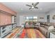 Inviting living room with a sectional sofa, modern furniture, and an open layout with plenty of light at 7699 Sw 74Th Loop, Ocala, FL 34481