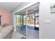 Slider doors from living room leading to screened patio overlooking the backyard at 7699 Sw 74Th Loop, Ocala, FL 34481