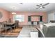 Open-concept living and dining area with tile flooring, ceiling fan, and comfortable seating at 7699 Sw 74Th Loop, Ocala, FL 34481