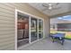 Screened in patio featuring a view of the lawn and slider doors to the living room at 7699 Sw 74Th Loop, Ocala, FL 34481