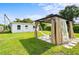 Spacious backyard featuring a gazebo, lush green lawn, and a serene outdoor setting at 859 Neuse Ave, Orlando, FL 32804