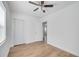 A bedroom showcasing wood-look flooring, a closet, and a bright and inviting atmosphere at 859 Neuse Ave, Orlando, FL 32804