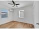 Bright bedroom featuring light wood floors, white walls, and a ceiling fan at 859 Neuse Ave, Orlando, FL 32804