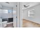 Bright bedroom with wood-look flooring next to bathroom at 859 Neuse Ave, Orlando, FL 32804