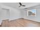 Bright bedroom with wood-look flooring and a ceiling fan at 859 Neuse Ave, Orlando, FL 32804