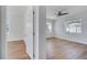 Bright bedroom featuring light wood floors, white walls, and a modern ceiling fan at 859 Neuse Ave, Orlando, FL 32804