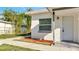 Rear exterior view of a house with a walkway, window, and door at 859 Neuse Ave, Orlando, FL 32804