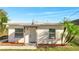 Charming home featuring an inviting front entrance with a well-manicured lawn at 859 Neuse Ave, Orlando, FL 32804