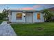 View of the home's exterior showing the newly installed walkway and manicured front lawn at 859 Neuse Ave, Orlando, FL 32804