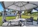 Comfortable gazebo setup with chairs and a table on a bed of white rock at 859 Neuse Ave, Orlando, FL 32804