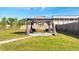 Backyard gazebo offering a relaxing outdoor space with chairs and stone pavers at 859 Neuse Ave, Orlando, FL 32804