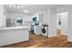 Kitchen featuring stainless steel appliances, wood-look flooring and white cabinetry at 859 Neuse Ave, Orlando, FL 32804