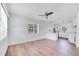 Bright and airy living room featuring newly installed wood laminate flooring, complemented by crisp, neutral paint at 859 Neuse Ave, Orlando, FL 32804