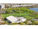 An aerial shot shows athletic fields and a complex near a pond at 859 Neuse Ave, Orlando, FL 32804