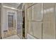 Bathroom showcasing a decorative shower door, wood floors, and modern fixtures at 868 Shell Ln, Longwood, FL 32750
