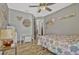 Comfortable bedroom boasts wood-look flooring, offering ample space for a play area at 868 Shell Ln, Longwood, FL 32750