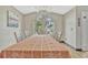 Well-lit dining area features a large window offering pleasant views, perfect for Gathering gatherings and entertaining guests at 868 Shell Ln, Longwood, FL 32750