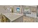Kitchen with spacious island countertop and modern appliances at 868 Shell Ln, Longwood, FL 32750