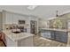 Spacious kitchen featuring an island, stainless steel appliances, and an abundance of counter space at 868 Shell Ln, Longwood, FL 32750