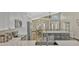 This open kitchen is complemented by stone countertops, modern cabinetry, and views into the dining area at 868 Shell Ln, Longwood, FL 32750