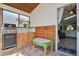 Outdoor space featuring a built-in grill, sink, custom cabinets, and a decorative wood wall at 868 Shell Ln, Longwood, FL 32750