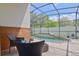 Screened-in pool area offering relaxing seating, a raised spa, and a meticulously landscaped yard at 868 Shell Ln, Longwood, FL 32750