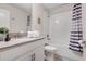 Bathroom featuring a shower and tub combo, modern vanity and neutral finishes at 8816 Cruden Bay Ct, Davenport, FL 33896