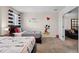 The bedroom boasts twin beds, themed decor, and an adjacent sitting room, perfect for relaxation and play at 8816 Cruden Bay Ct, Davenport, FL 33896