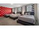 Large bedroom features three twin beds, striped drapes, and Mickey Mouse decor at 8816 Cruden Bay Ct, Davenport, FL 33896