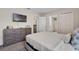 Bedroom with TV, dresser, bed and carpet at 8816 Cruden Bay Ct, Davenport, FL 33896