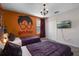 The themed bedroom includes twin beds, a decorative wall mural, and plush bedding at 8816 Cruden Bay Ct, Davenport, FL 33896