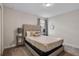 Neutral bedroom with soft carpet, a window with blinds and neutral decor at 8816 Cruden Bay Ct, Davenport, FL 33896
