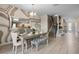 Elegant dining room with stylish table setting, designer wall decor, and seamless access to the staircase at 8816 Cruden Bay Ct, Davenport, FL 33896