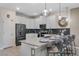 Beautiful kitchen featuring white cabinets, stainless steel appliances, and an island with bar seating at 8816 Cruden Bay Ct, Davenport, FL 33896