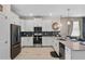 Well-equipped kitchen showcasing modern appliances, a stylish backsplash, and ample counter space at 8816 Cruden Bay Ct, Davenport, FL 33896