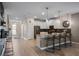 Spacious kitchen with white cabinetry, a center island, and an open layout flowing into other living spaces at 8816 Cruden Bay Ct, Davenport, FL 33896