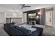 Upstairs loft featuring a dark accent wall, comfortable seating, and access to other rooms at 8816 Cruden Bay Ct, Davenport, FL 33896