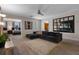 Comfortable upstairs loft area with plush seating, decorative wall mirror, and access to other rooms at 8816 Cruden Bay Ct, Davenport, FL 33896
