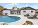 Inviting backyard featuring a private pool and lounge chairs on a spacious patio at 9235 Everwood St, Orlando, FL 32825