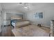 Neutral bedroom with a vaulted ceiling, ornate furnishings, and soft natural lighting at 9235 Everwood St, Orlando, FL 32825