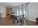 Dining area with wood table, stylish chairs and an abundance of natural light at 9235 Everwood St, Orlando, FL 32825