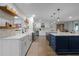 Modern kitchen featuring custom cabinets, stainless steel appliances and a large island at 9235 Everwood St, Orlando, FL 32825