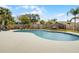Backyard pool surrounded by lush tropical landscaping and fencing for privacy at 9235 Everwood St, Orlando, FL 32825