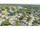 An aerial view shows a desirable community with lush trees, serene lakes, and well-kept residences at 442 Flora Creek Ct, Lake Mary, FL 32746