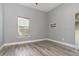 Bright bedroom with gray walls and wood floors, offering a neutral and inviting space at 442 Flora Creek Ct, Lake Mary, FL 32746